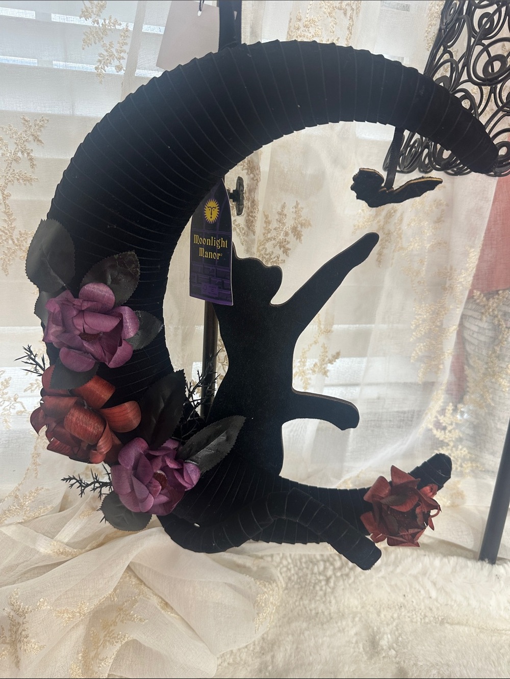 Moonlight Manor crescent moon wreath features a black cat silhouette